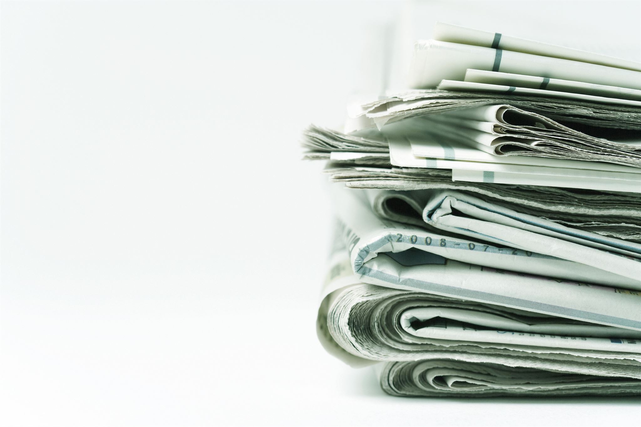 Closeup-of-stacked-newspapers